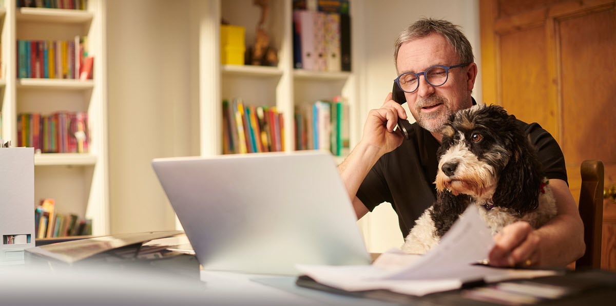mature man working from home or sorting the home finances